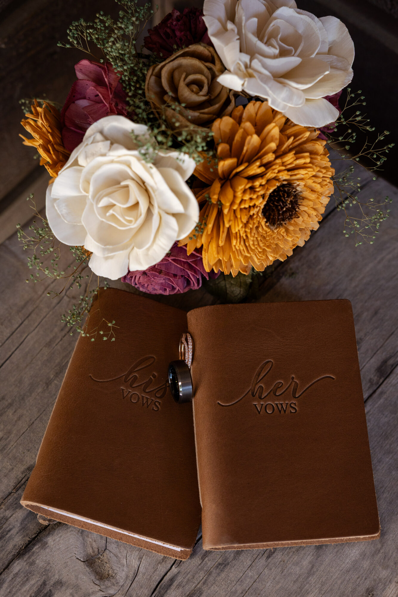 A Loveland Pass Elopement in Colorado: Horseback Riding and a Mountain Wedding | Scenic Vows Wedding details with customized vow books, rings, and bouquet for a Loveland Pass elopement in Colorado