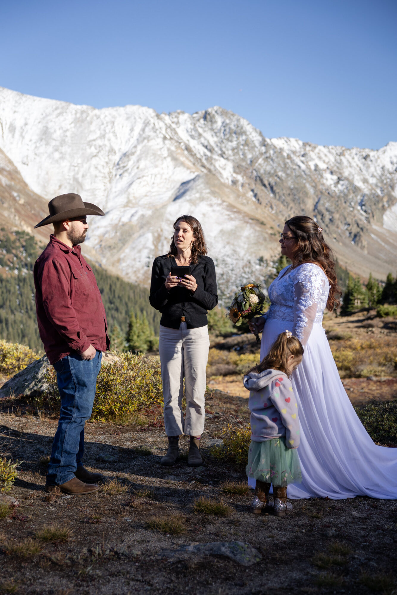 A Loveland Pass Elopement in Colorado: Horseback Riding and a Mountain Wedding | Scenic Vows Loveland Pass elopement ceremony with family in Colorado mountains