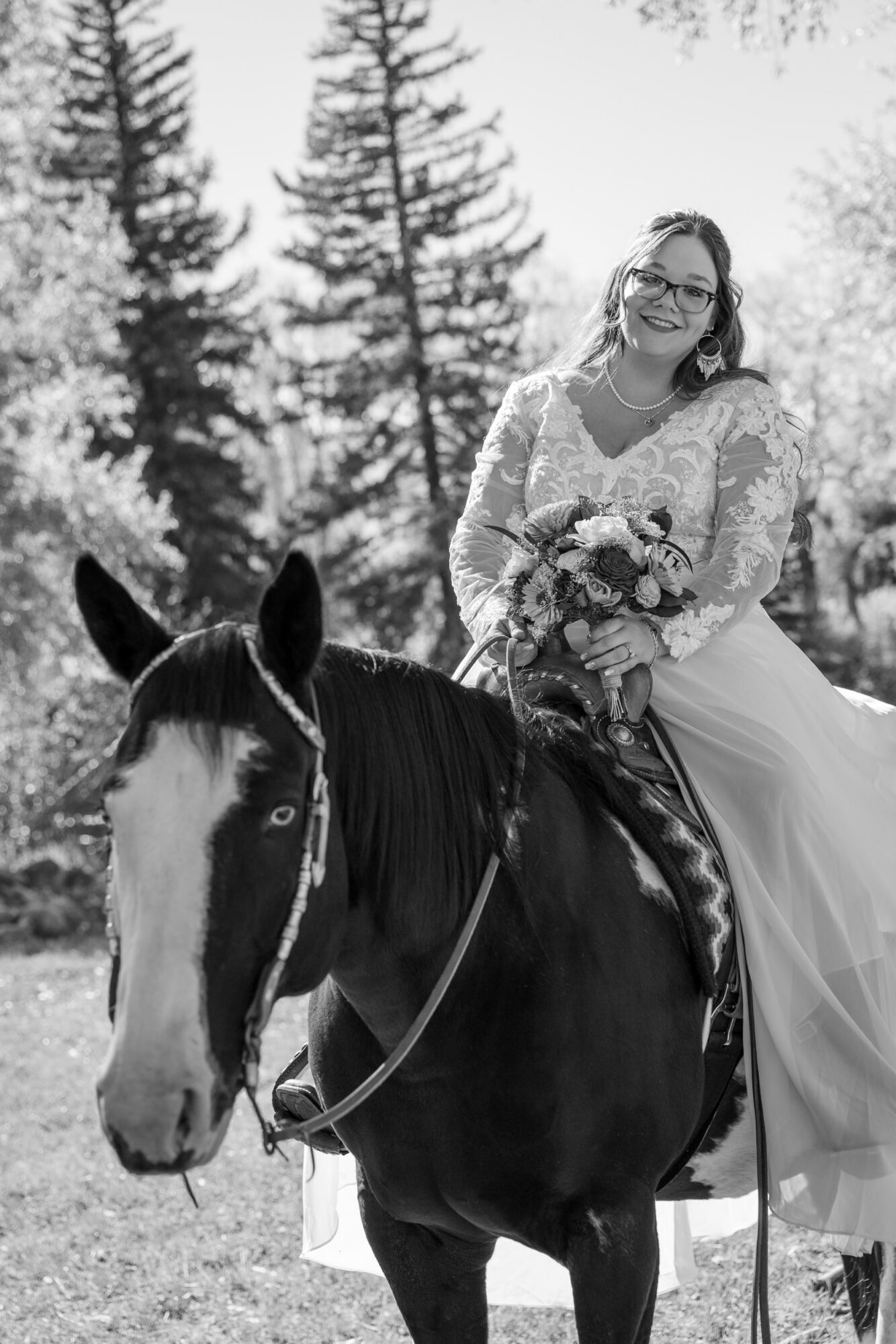 A Loveland Pass Elopement in Colorado: Horseback Riding and a Mountain Wedding | Scenic Vows Bride riding a horse during an adventurous Colorado mountain elopement