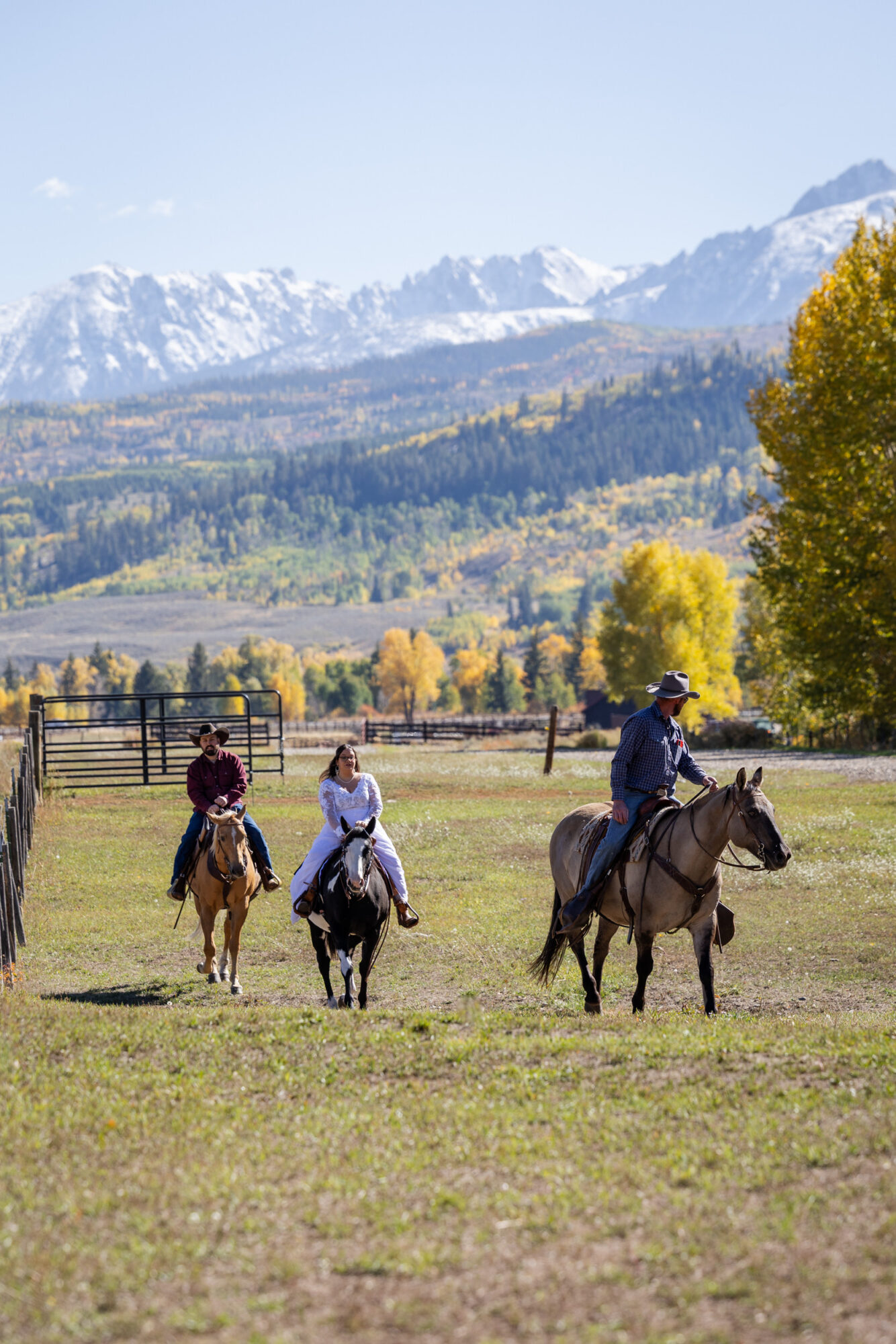 A Loveland Pass Elopement in Colorado: Horseback Riding and a Mountain Wedding | Scenic Vows Wide view of horseback riding elopement with mountain backdrop in Colorado near Loveland Pass