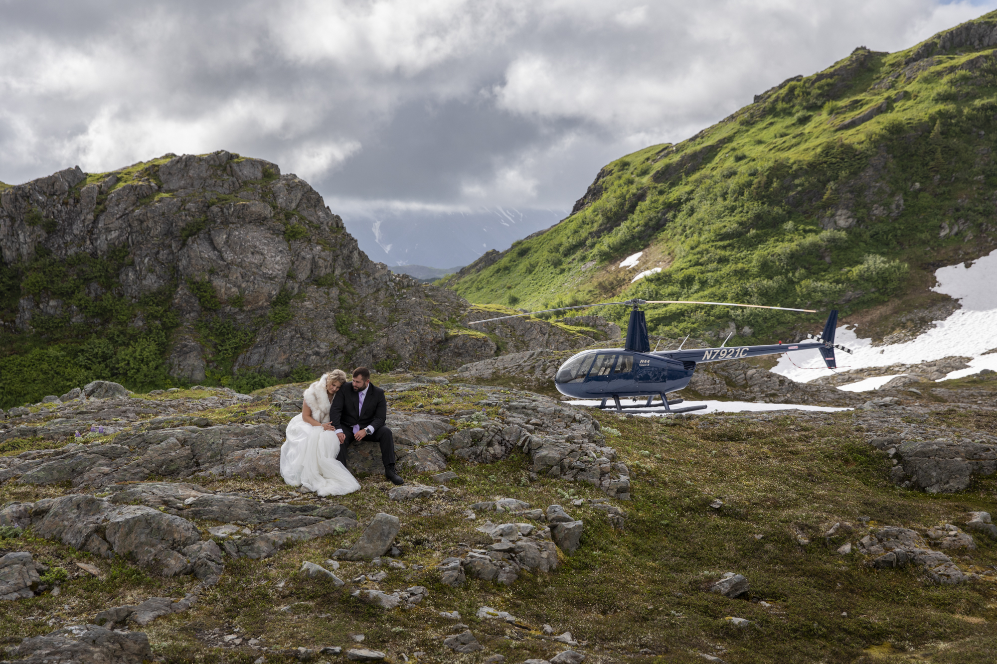 Where to Elope: How to Choose the Perfect Elopement Location | Scenic Vows couple standing on glacier ice beside alpine lake during remote glacier elopement