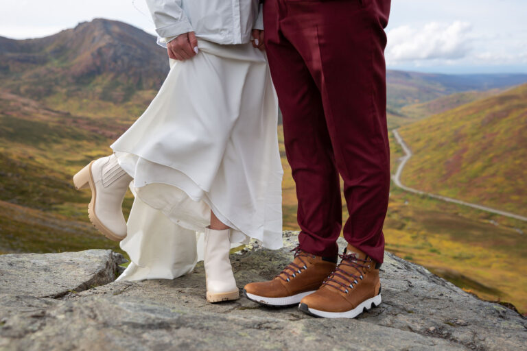 Boot picture of bride's white boots and groom's brown boots.