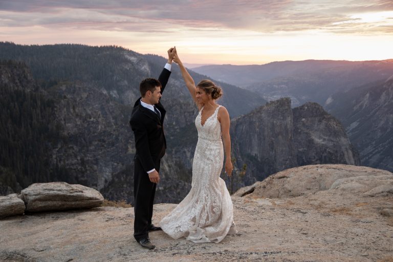 A bride and groom dance at Taft Point on their Yosemite elopement day.