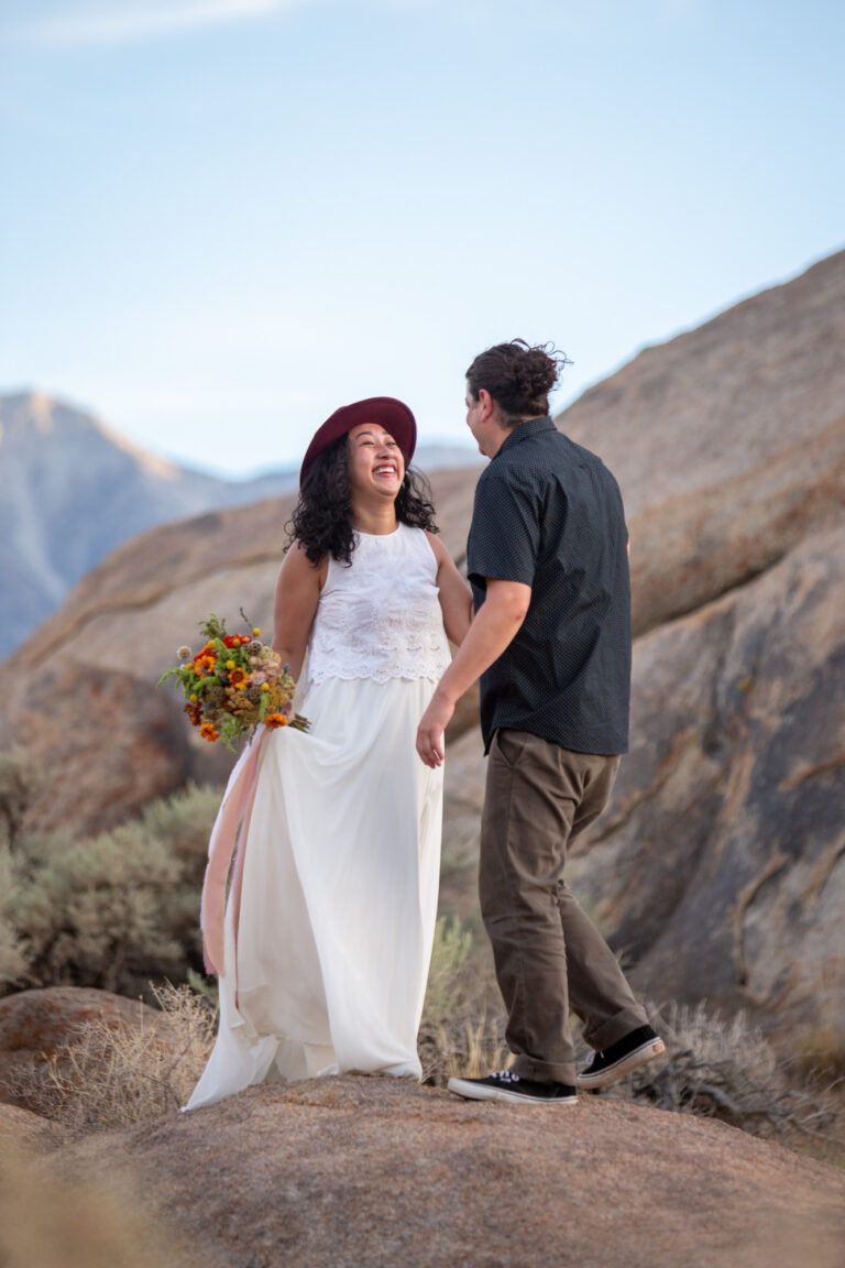 A bride smiles up at her groom on their Alabama Hills Adventure elopement day.