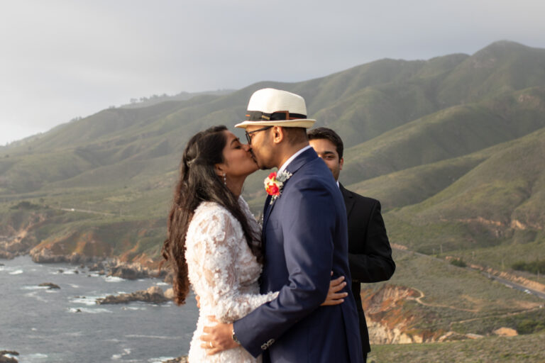A bride and groom share their first kiss as husband and wife