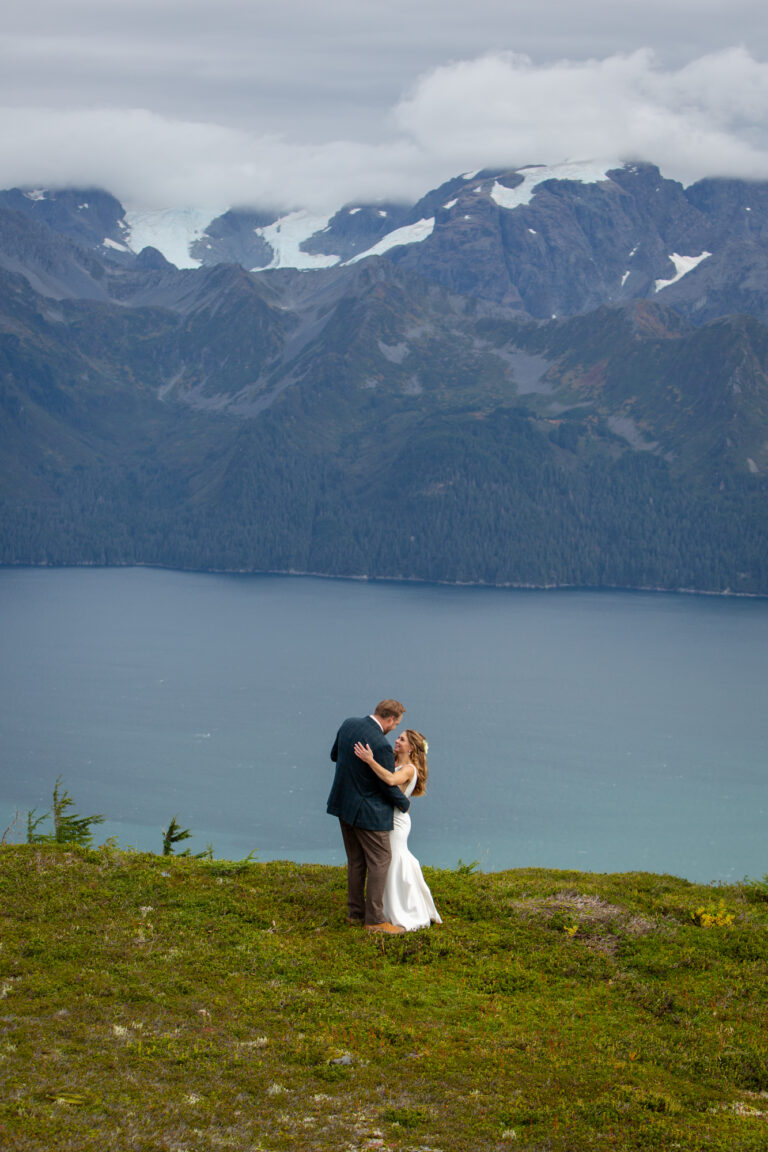 Bride and groom share their first dance together overlooking the Resurrection Bay in Seward Alaska.
