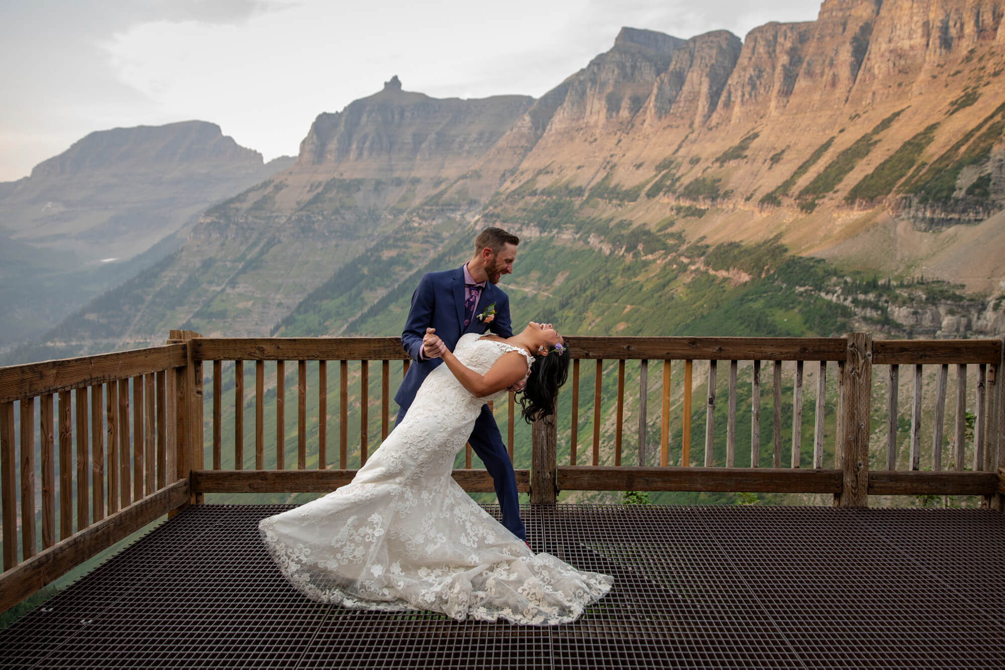Where to Elope: How to Choose the Perfect Elopement Location | Scenic Vows couple dancing on mountain overlook deck during scenic mountain elopement