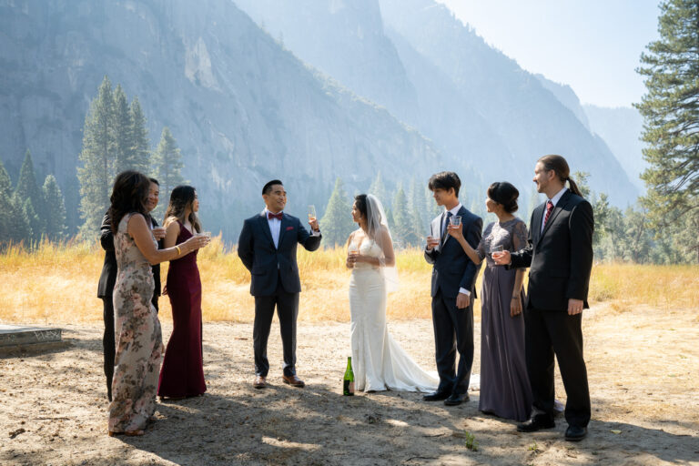 A groom makes a toast to his bride and family on his intimate wedding day in Yosemite.